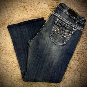Blue Boot Cut Jeans with Distressing and Vintage Look